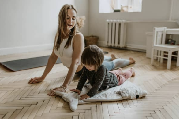 mom doing yoga with child